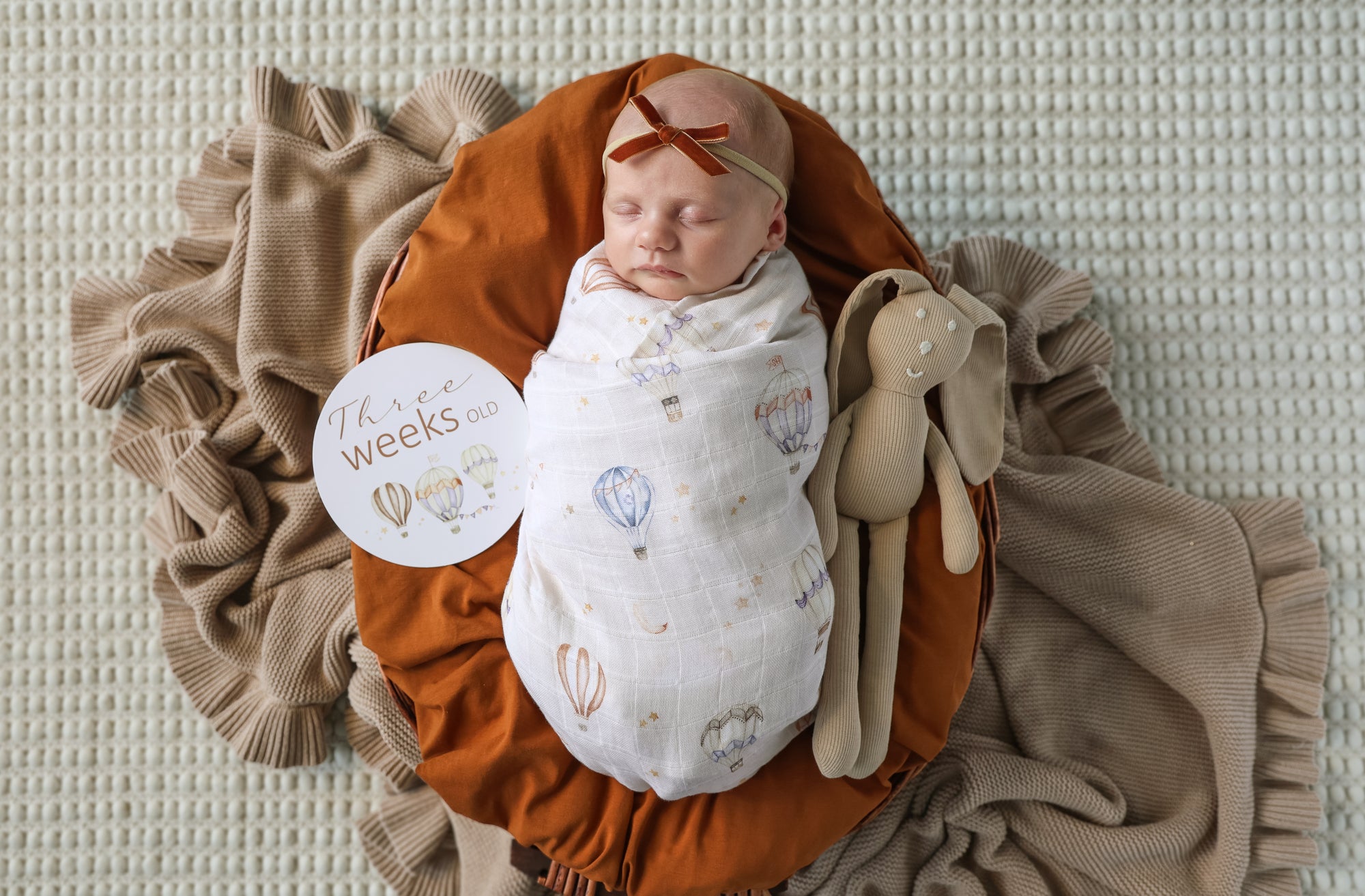 Soft Up & Away organic muslin wrap featuring a charming hot air balloon print, made from breathable organic cotton for swaddling, pram outings, feeding and everyday baby comfort.