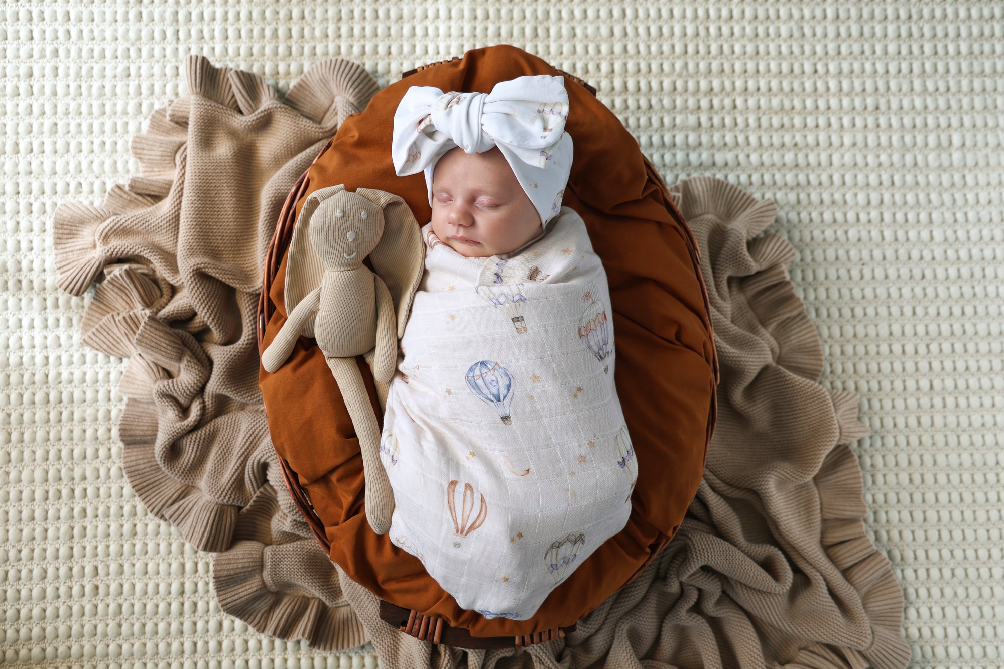 Soft Up & Away organic muslin wrap featuring a charming hot air balloon print, made from breathable organic cotton for swaddling, pram outings, feeding and everyday baby comfort.