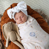 Soft Up & Away organic muslin wrap featuring a charming hot air balloon print, made from breathable organic cotton for swaddling, pram outings, feeding and everyday baby comfort.
