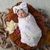 Soft Up & Away organic muslin wrap featuring a charming hot air balloon print, made from breathable organic cotton for swaddling, pram outings, feeding and everyday baby comfort.