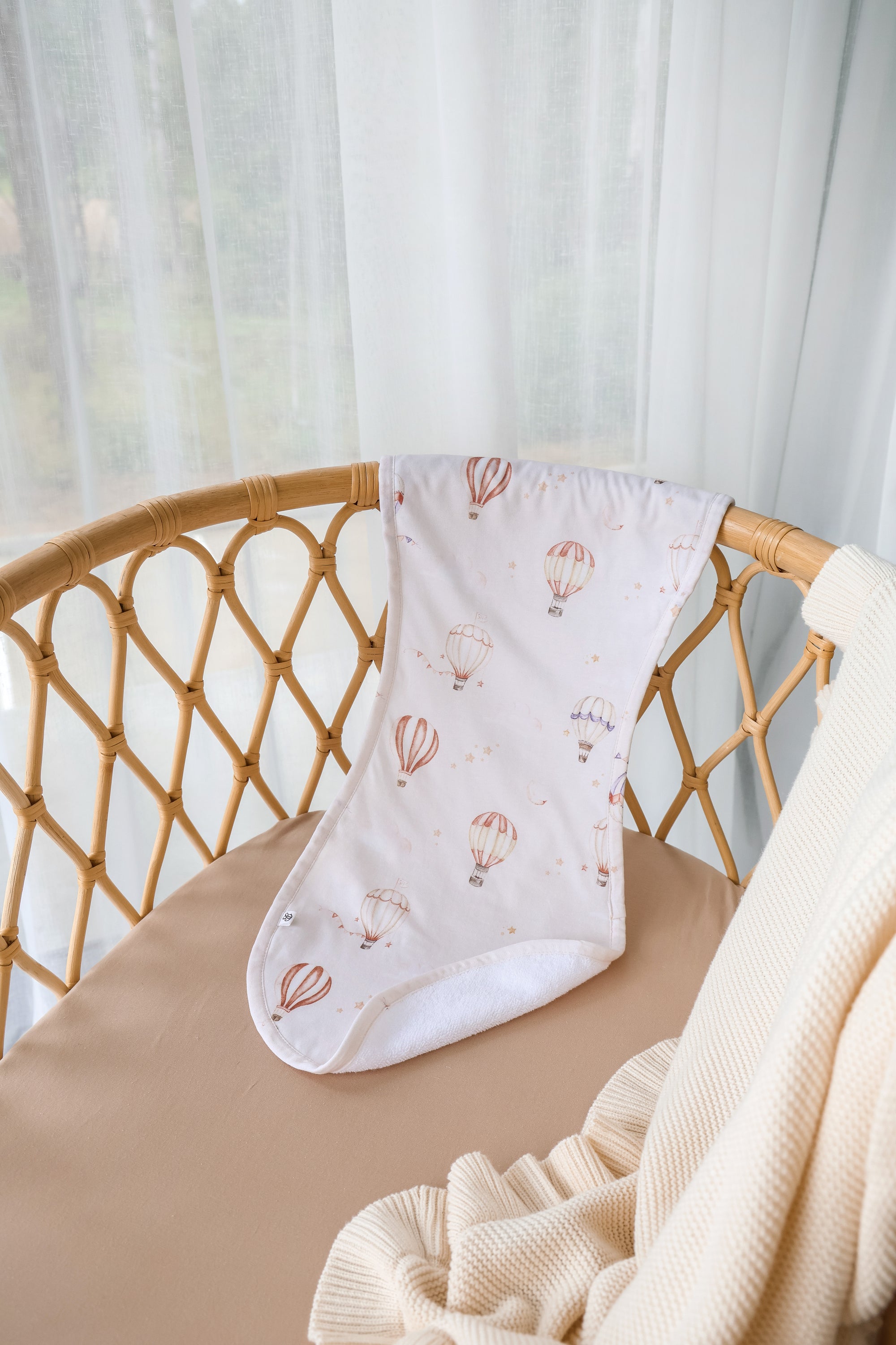 Soft Up & Away organic cotton burp cloth featuring a hot air balloon print, made from absorbent organic cotton to protect clothing during feeding and keep babies comfortable.