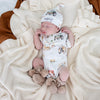 Soft hazelnut organic cotton knit baby booties designed to keep newborn feet warm and comfortable, featuring a timeless neutral colour for everyday wear or gifting.