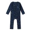 Baby wearing the Starry Night organic cotton convertible romper with fold-over feet and mittens, featuring a soft star print for comfortable day and night wear.