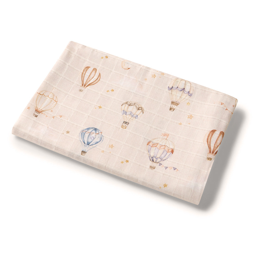 Soft Up & Away organic muslin wrap featuring a charming hot air balloon print, made from breathable organic cotton for swaddling, pram outings, feeding and everyday baby comfort.