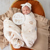 Soft Up & Away organic muslin wrap featuring a charming hot air balloon print, made from breathable organic cotton for swaddling, pram outings, feeding and everyday baby comfort.