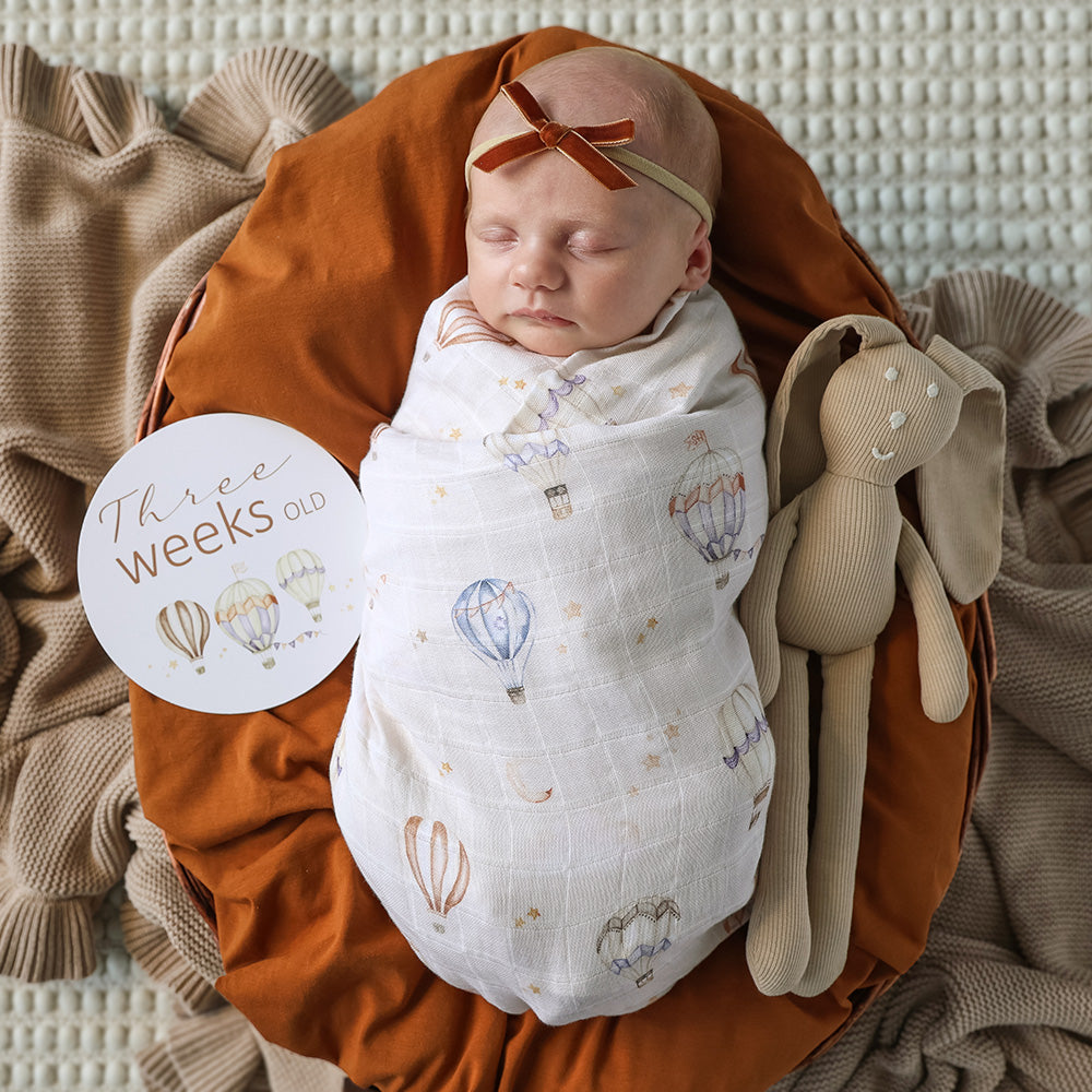 Soft Up & Away organic muslin wrap featuring a charming hot air balloon print, made from breathable organic cotton for swaddling, pram outings, feeding and everyday baby comfort.